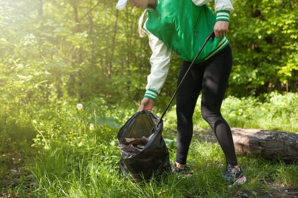 Volunteer picking up trash - Oleksandra Polishchuk
